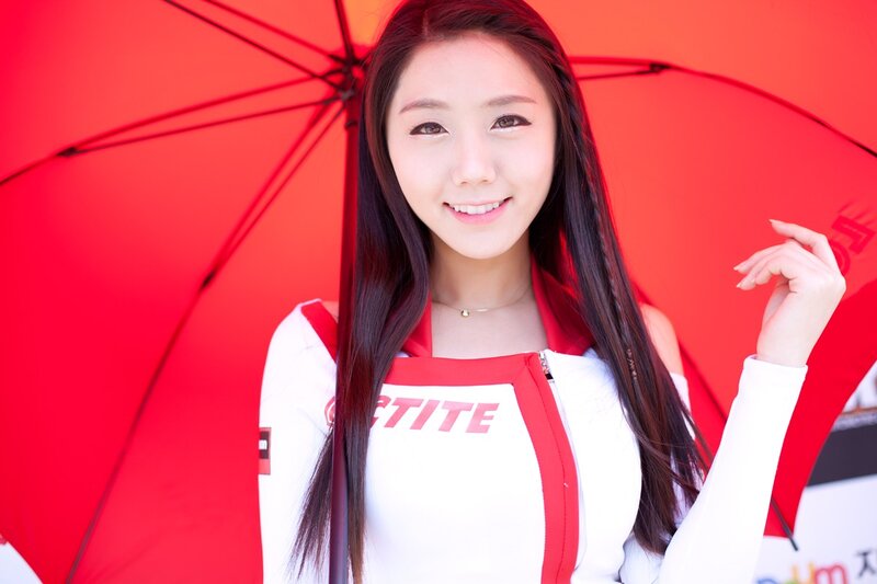 woman holding red umbrella