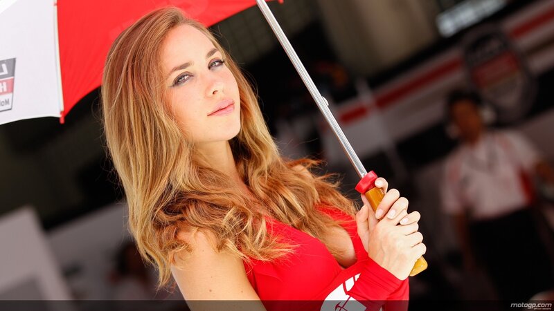 Woman holding red umbrella