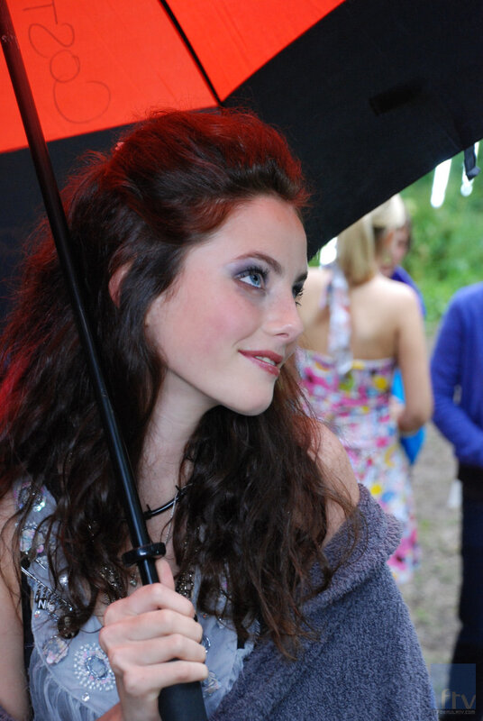 woman holding red umbrella