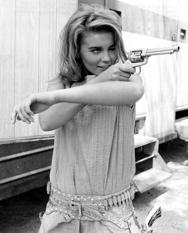 Woman Holding Revolver — Black, Dramatic