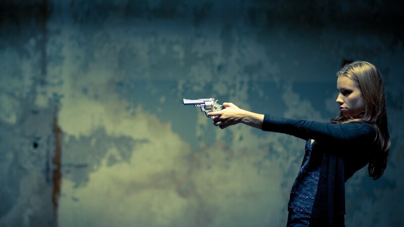 Woman Holding Revolver — Blue, Dramatic