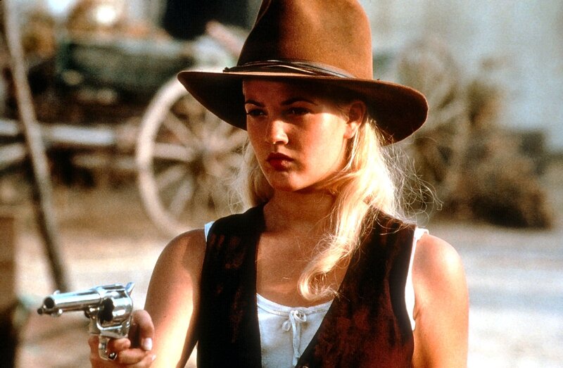 Woman Holding Revolver — Brown, Serious, Afternoon