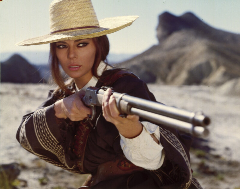 Woman Holding Rifle — Brown, Dramatic, Afternoon