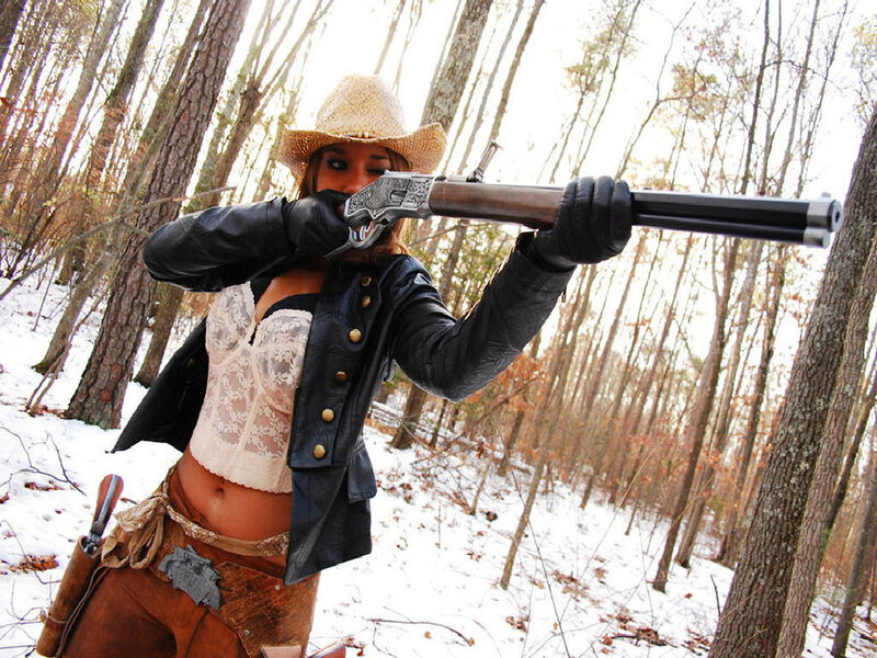 Woman Holding Rifle — Brown, Dramatic, Winter