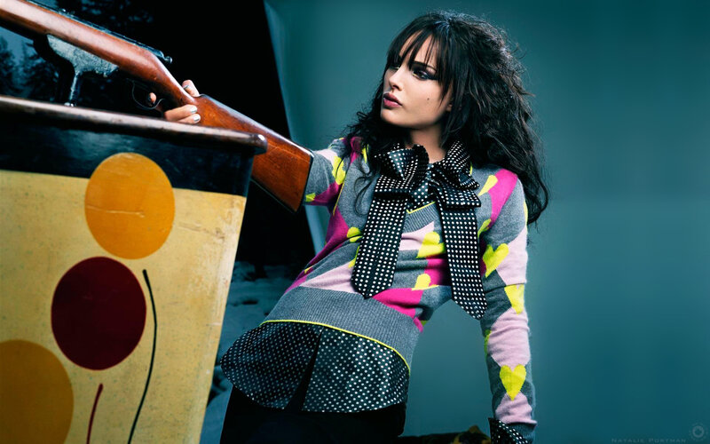 Woman Holding Rifle — Gray, Dramatic, Photograph, Sweater, Polka Dots