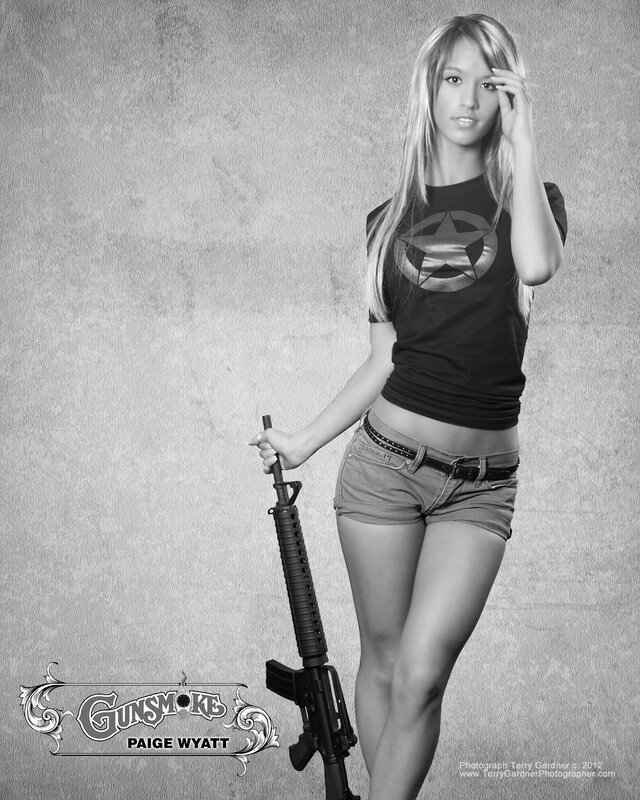 woman holding rifle in studio