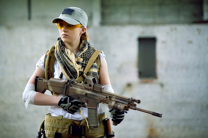 Woman Holding Rifle — Tan