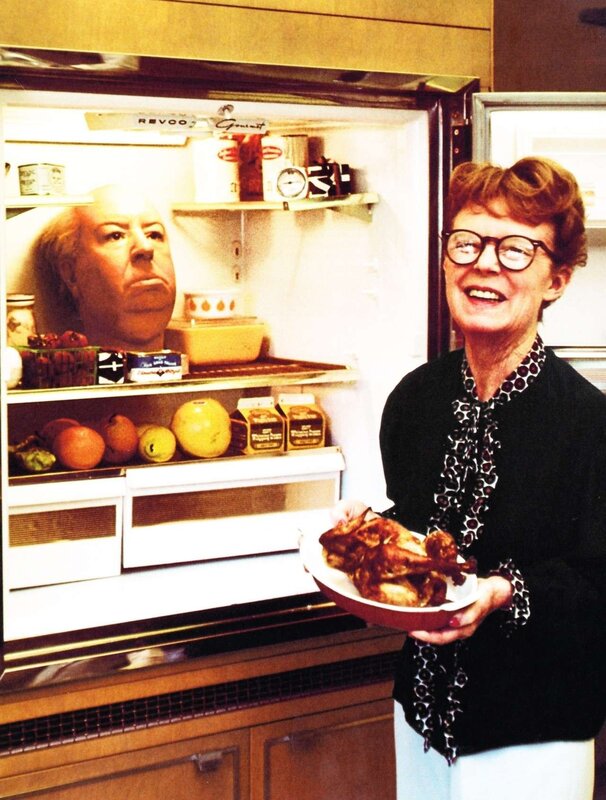 Woman holding roasted chicken
