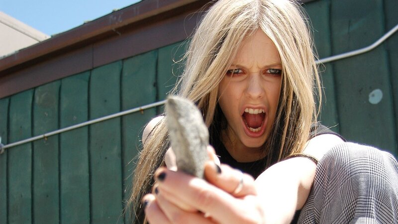 woman holding rock aggressively