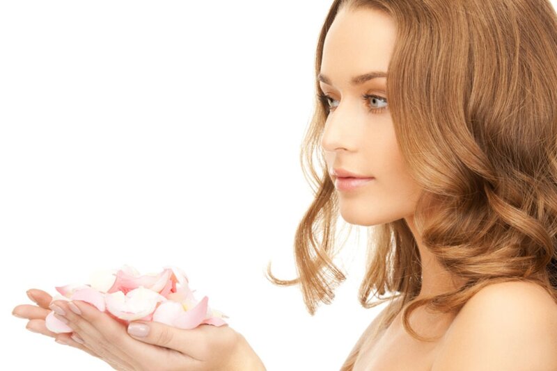 Woman Holding Rose Petals — White