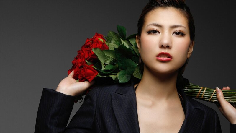 Woman Holding Roses — Black, Dramatic, Photograph, Suit Jacket