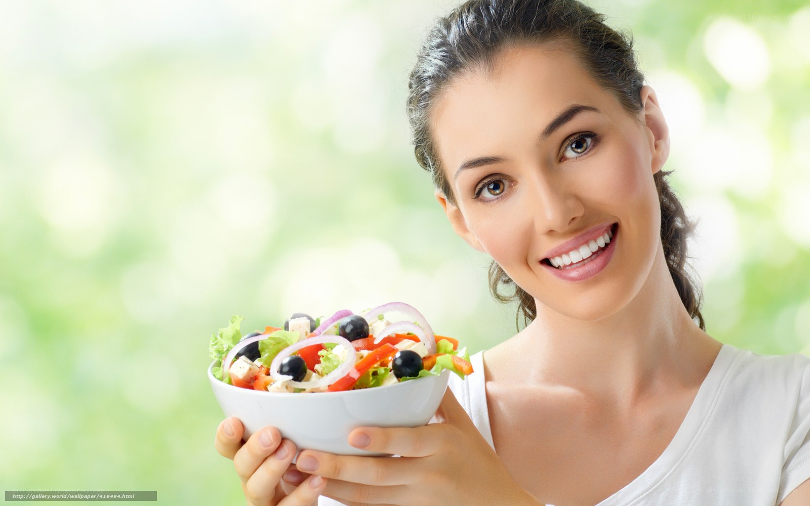 woman holding salad bowl