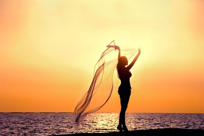 Woman Holding Scarf — Orange