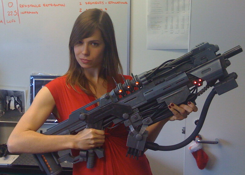 Woman holding sci-fi weapon