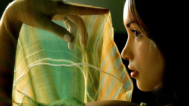 woman holding sheer fabric