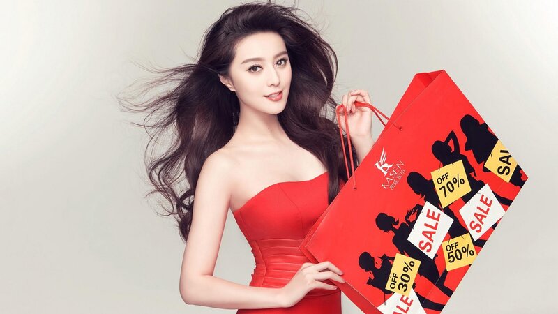 woman holding shopping bag