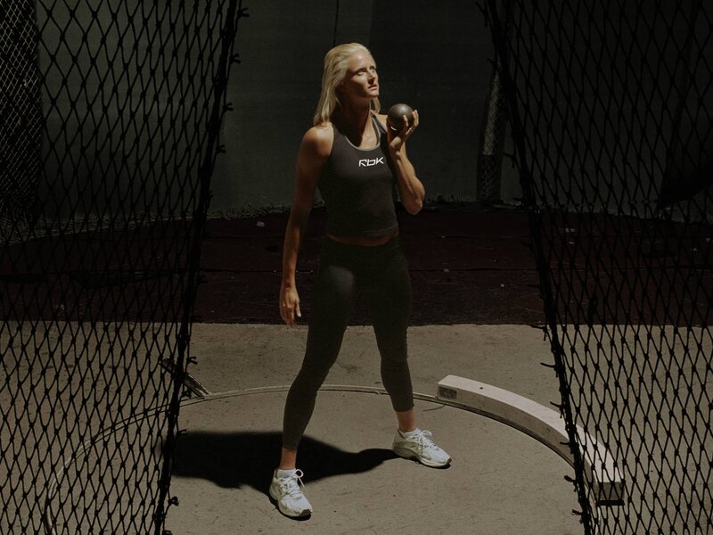 woman holding shot put