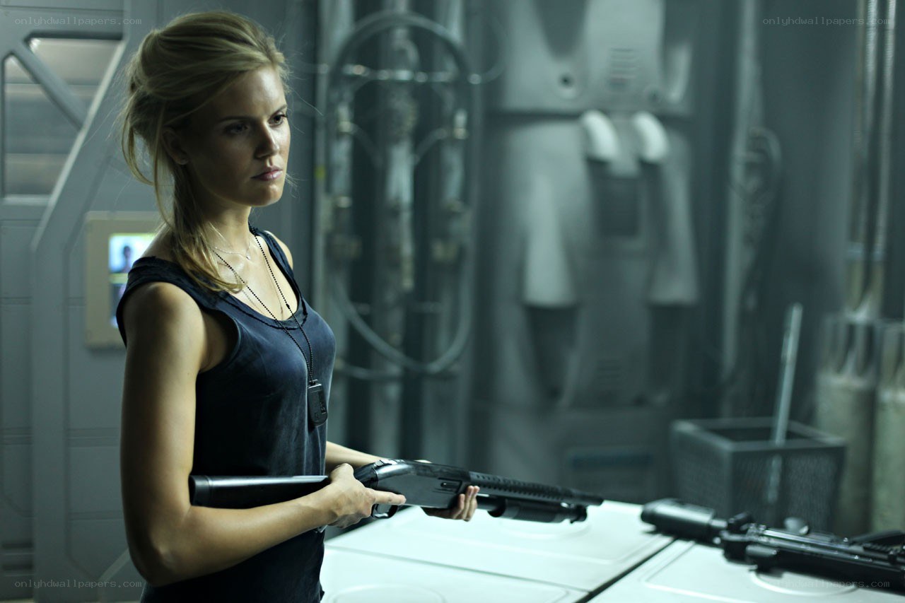 woman holding shotgun in sci-fi setting