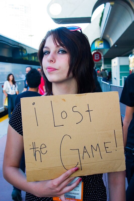 woman holding sign at event