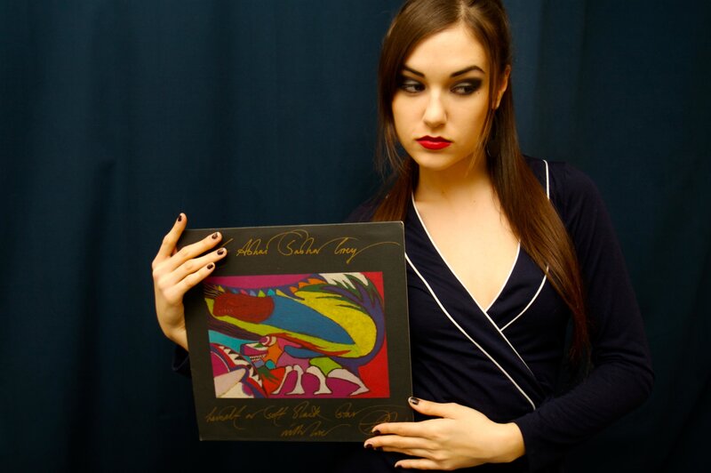 woman holding signed album