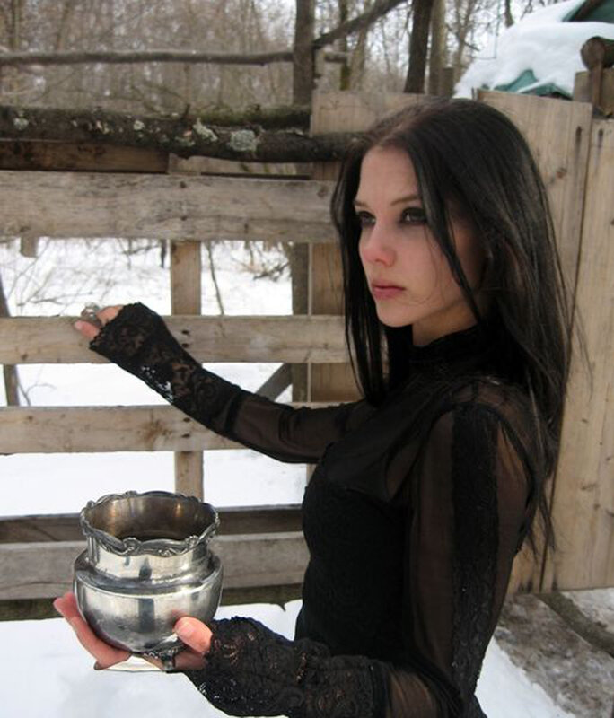 woman holding silver bowl in winter