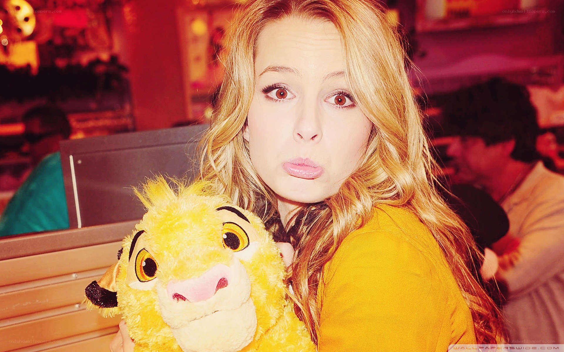 woman holding simba plush