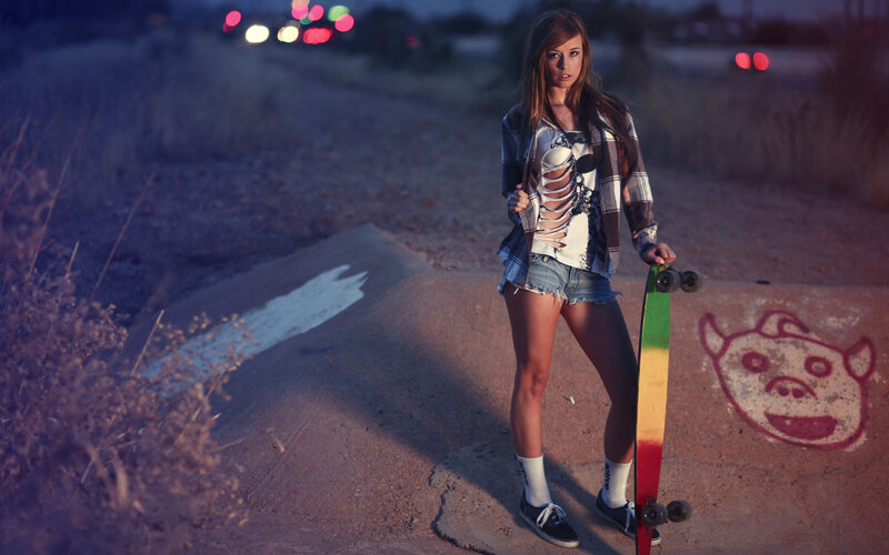 Woman Holding Skateboard — Purple