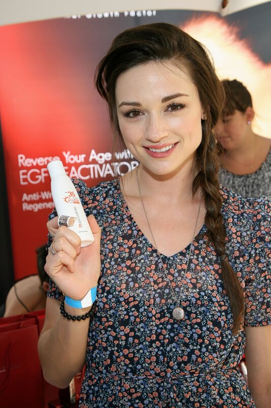 Woman holding skincare product