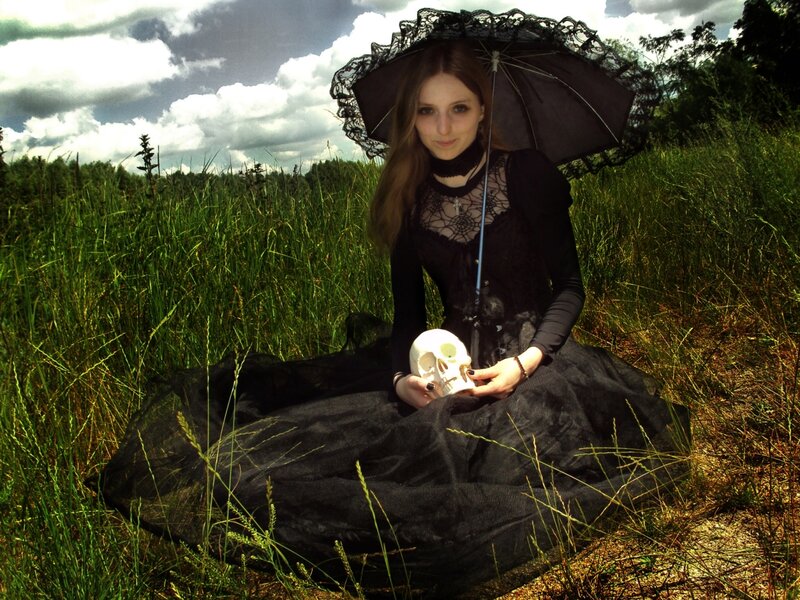 Woman Holding Skull — Black, Dramatic, Afternoon