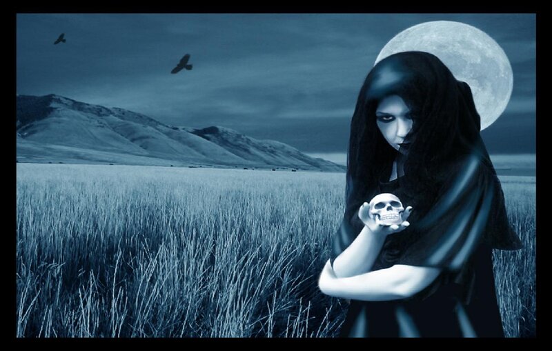 woman holding skull in moonlight