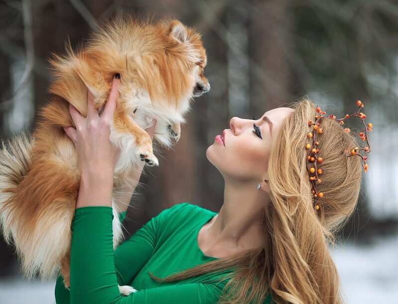 Woman Holding Small Dog — Green, Serene