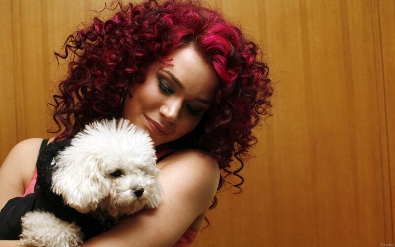 Woman Holding Small Dog — Red