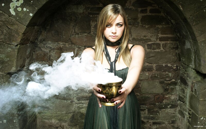 woman holding smoking bowl