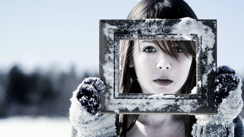 woman holding snow-covered frame