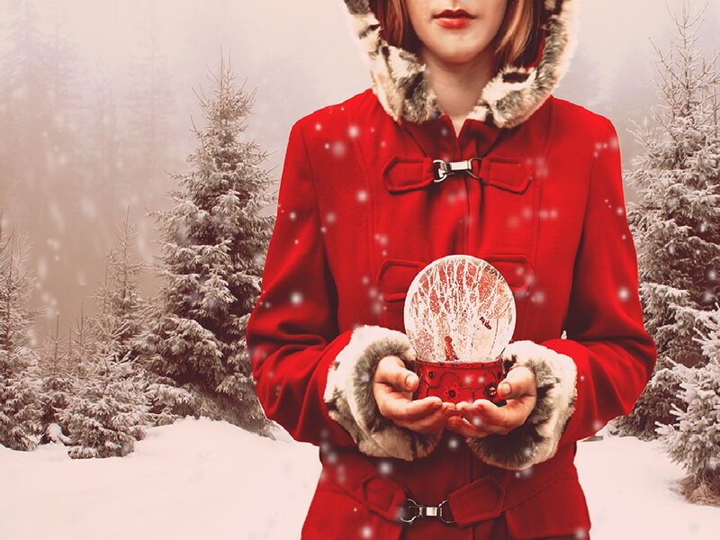 Woman Holding Snow Globe — Red