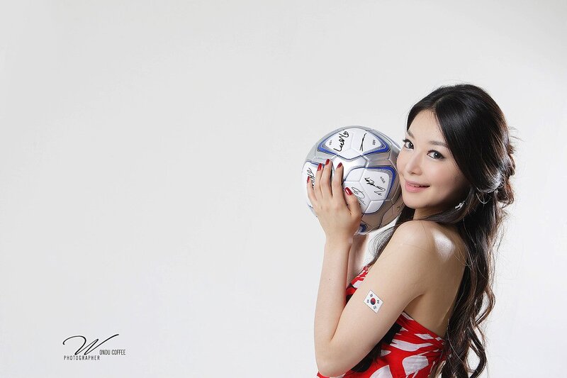 woman holding soccer ball