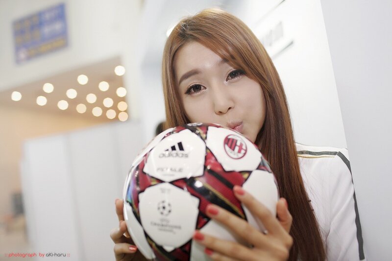 woman holding soccer ball