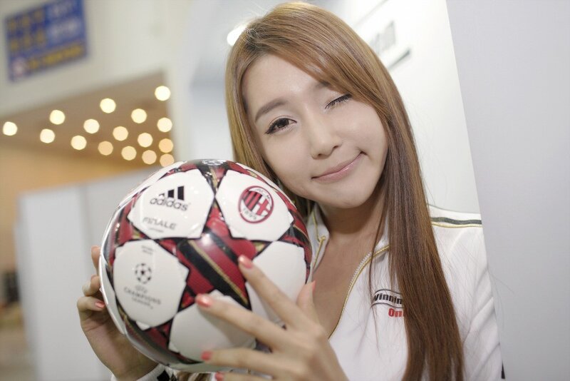 woman holding soccer ball