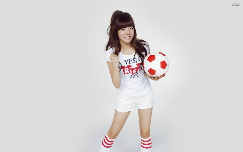 woman holding soccer ball