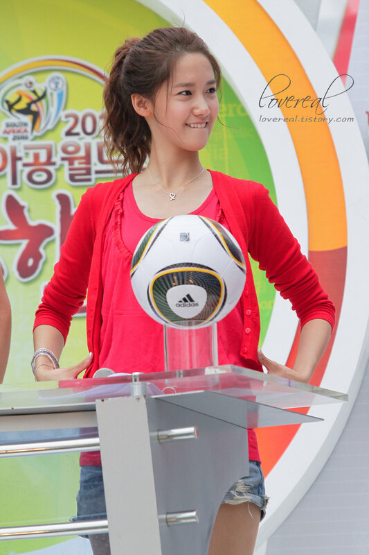 woman holding soccer ball