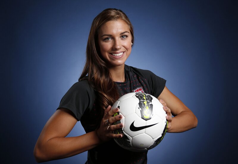 woman holding soccer ball