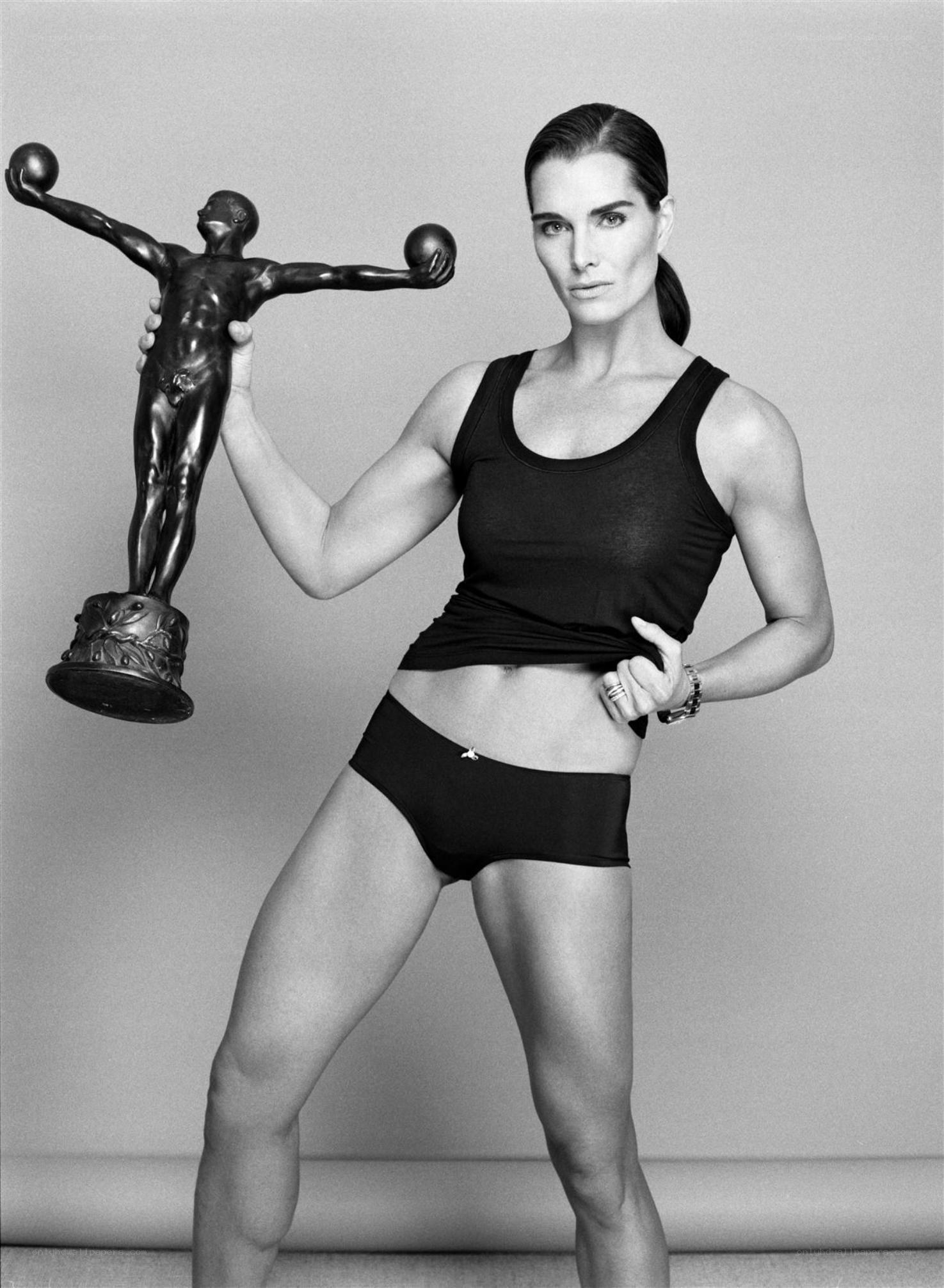 woman holding statue trophy
