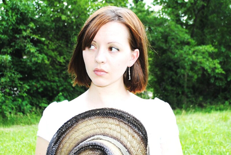 Woman Holding Straw Hat — Green