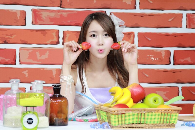 woman holding strawberries