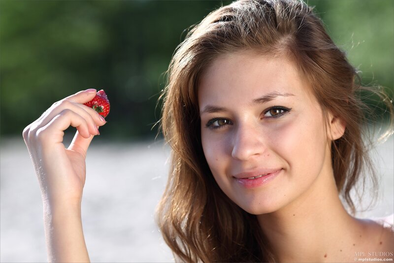 Woman Holding Strawberry — Brown