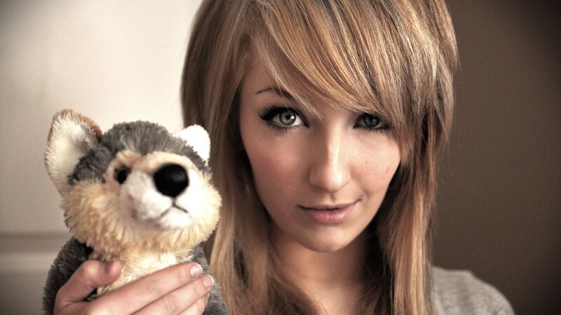 woman holding stuffed animal