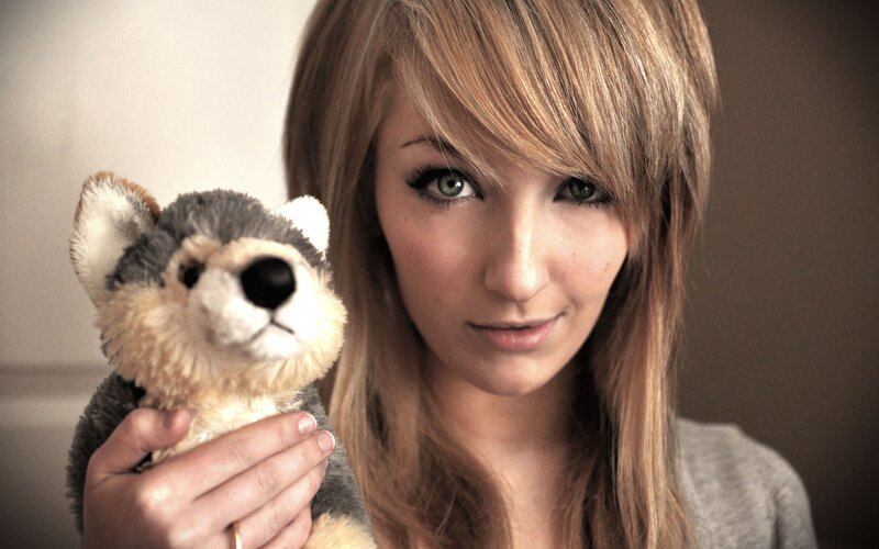 woman holding stuffed animal