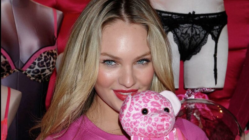 Woman Holding Stuffed Animal — Pink
