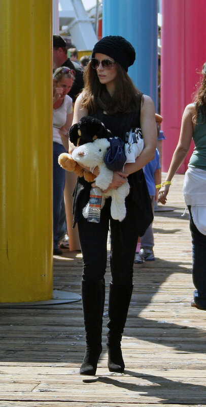 Woman holding stuffed animals