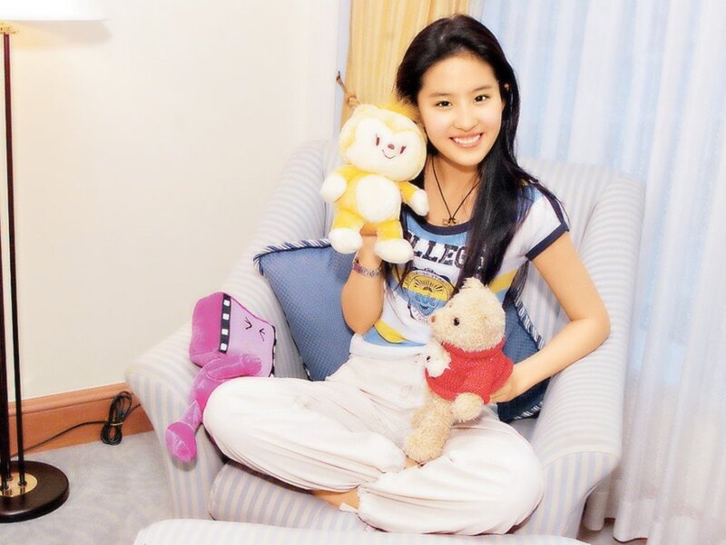 woman holding stuffed animals